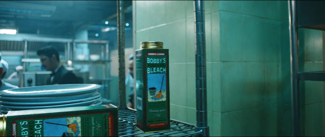 In Monkey Man (2024) the unnamed protagonist "Kid" goes by the pseudonym Bobby, which he reads off a bleach container #movie #MovieDetails